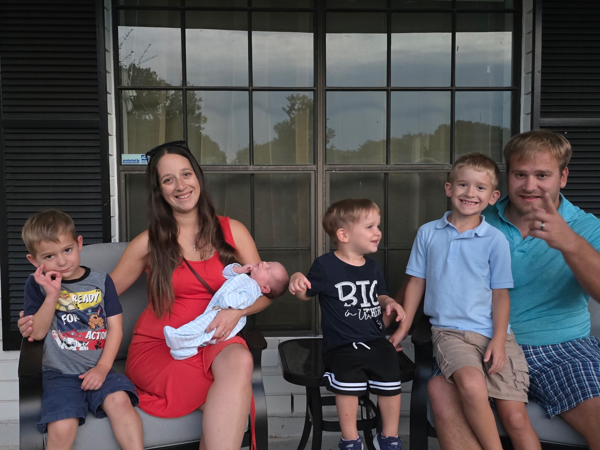 Jessica and her family of six gathered on their porch
